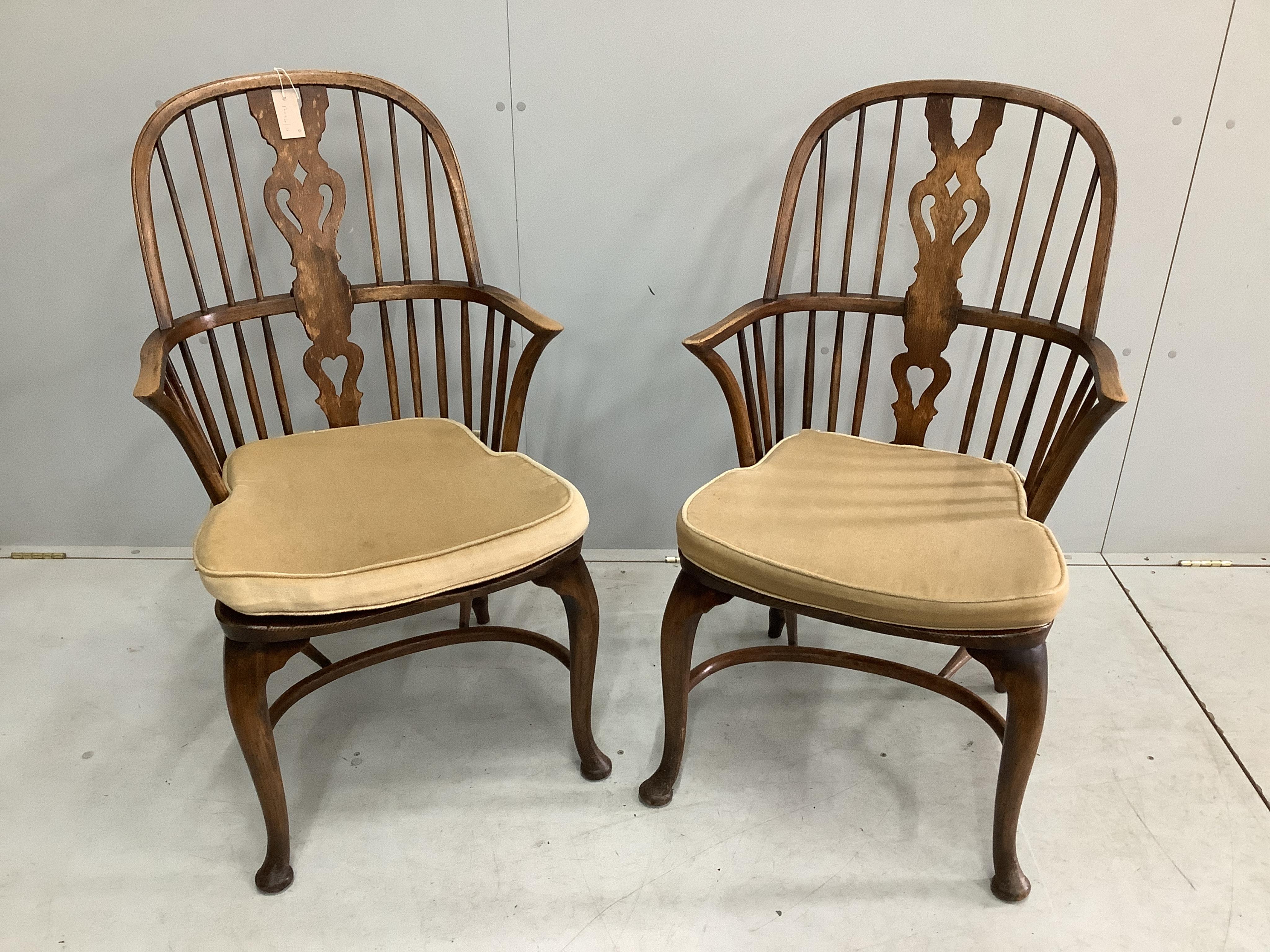 A set of eight reproduction elm and beech Windsor cabriole leg chairs, two with arms. Condition - fair